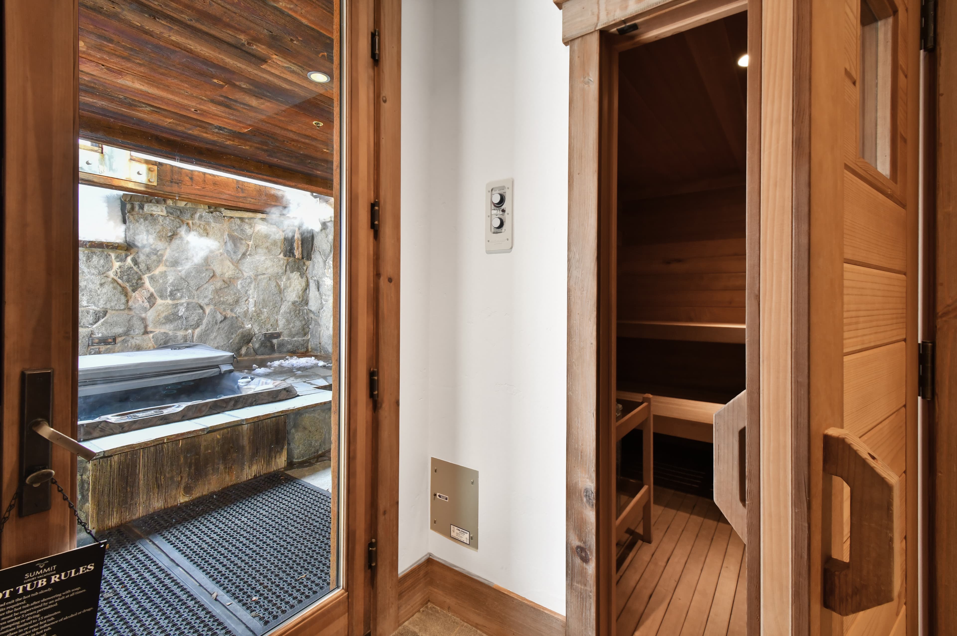 A hallway leads to either the home's sauna, or the private hot tub.