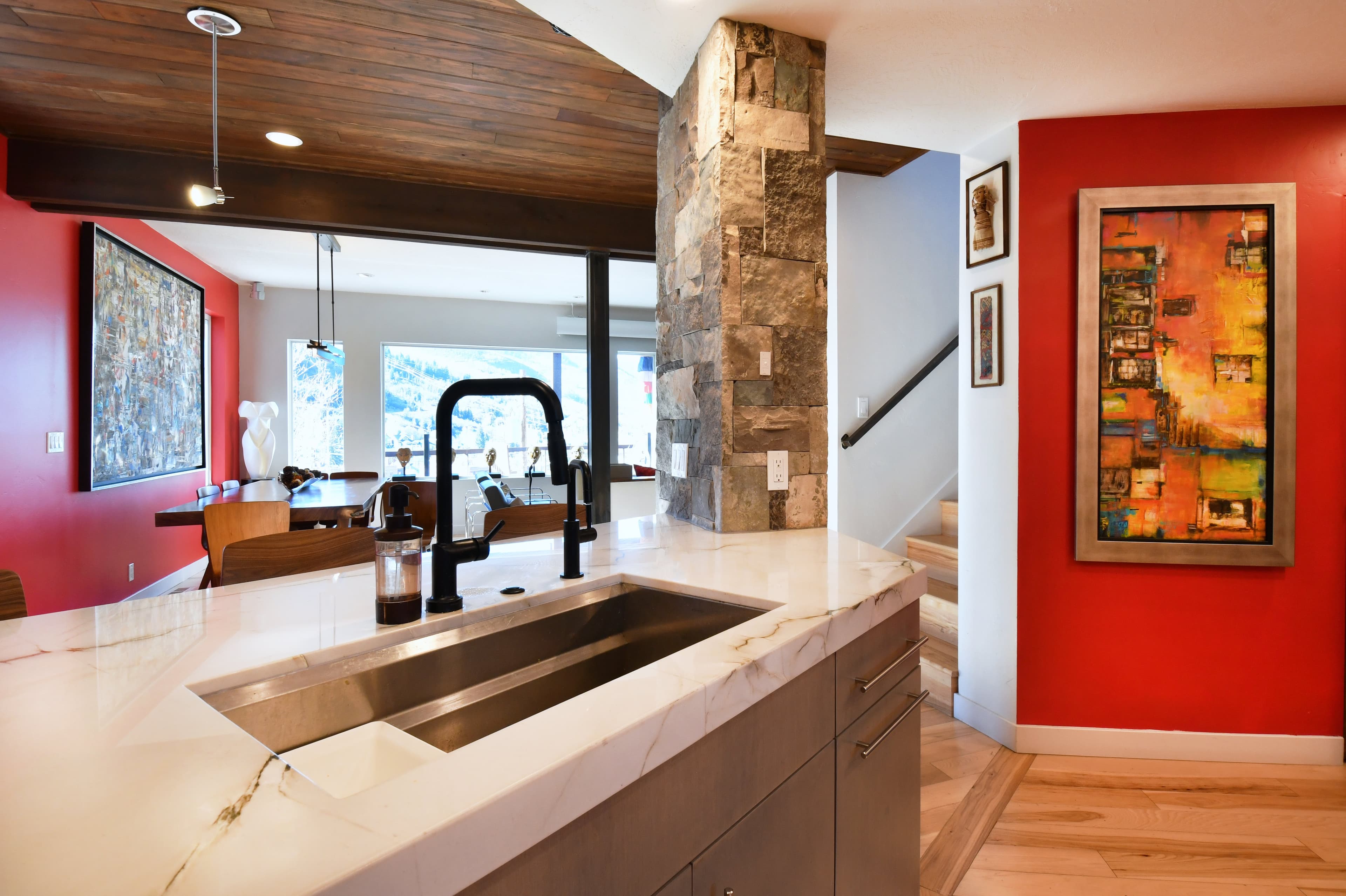 Kitchen with a Sink, Breakfast Bar and Living Room View