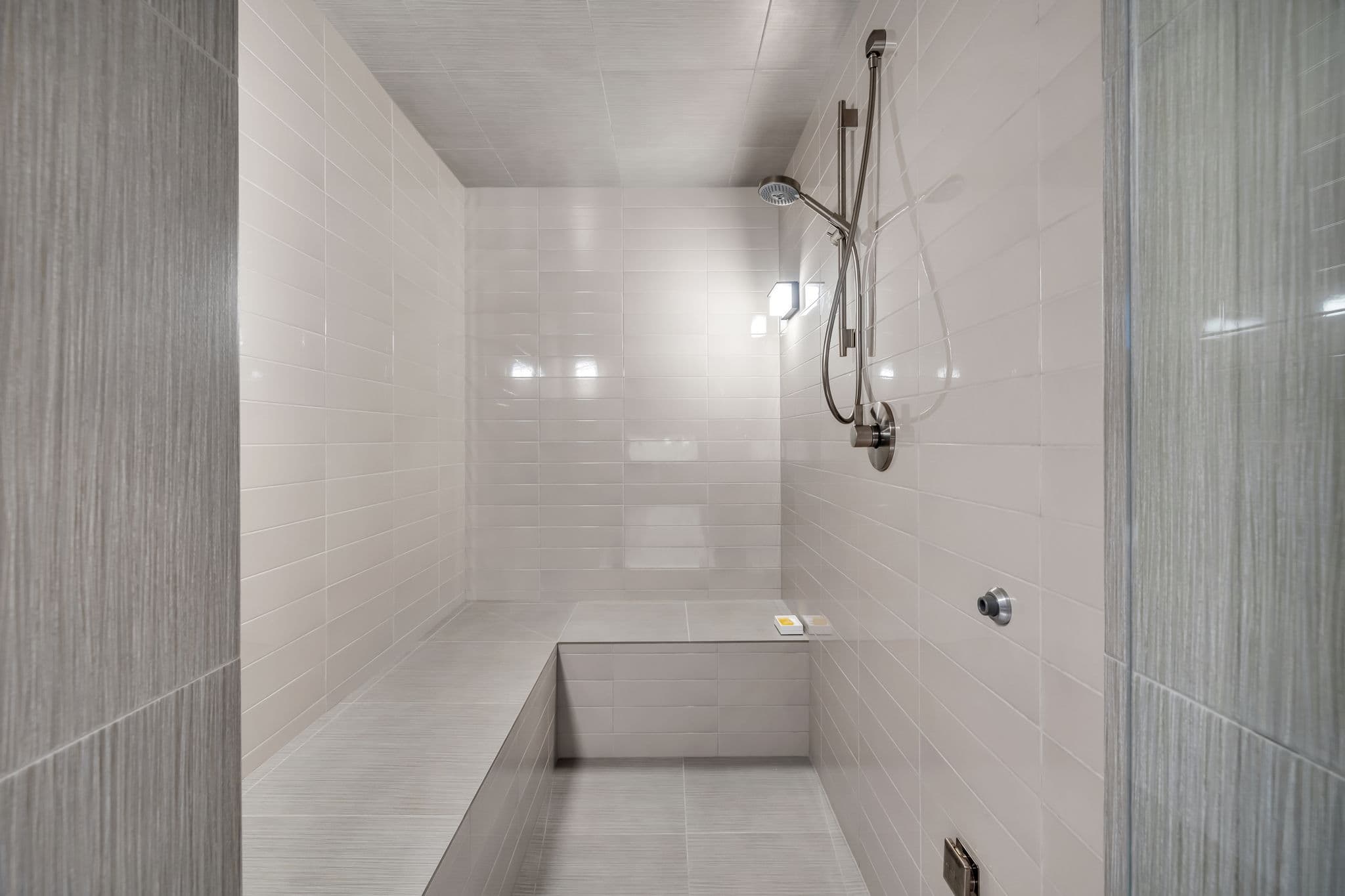 A sleek steam room with modern tile finishes.