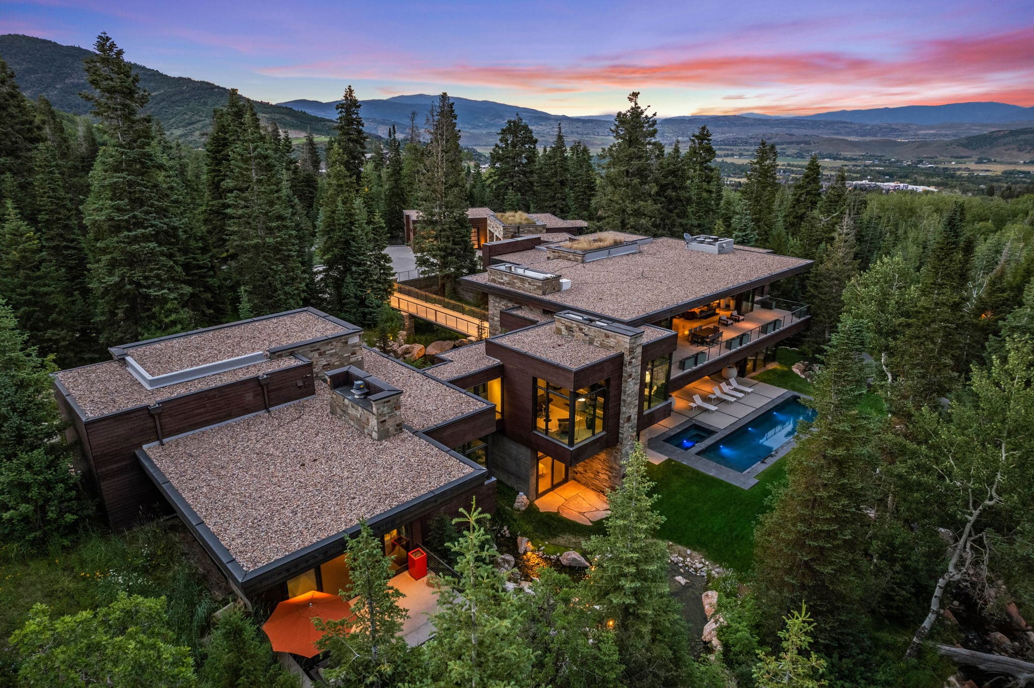 A White Pine Canyon Ranch luxury Park City vacation rental surrounded by lush forest.