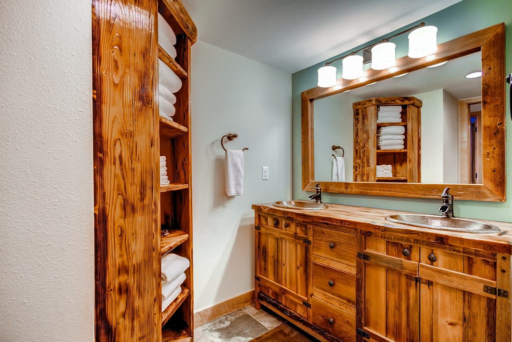 Jetted tub and shower combo in shared lower level bathroom - 4 O'Clock Lodge D26 Breckenridge Vacation Rental